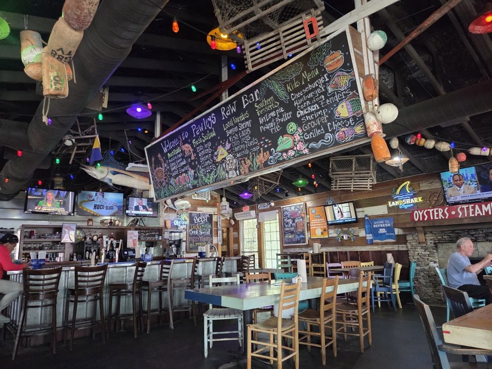 Relaxed bar area inside a seafood restaurant.