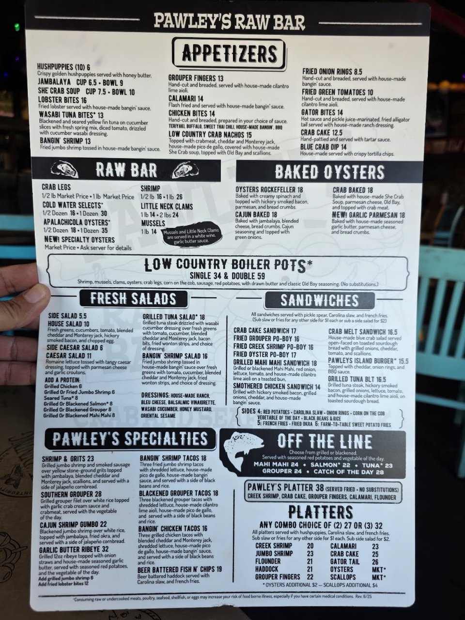 Menu page showing appetizers and raw bar items.